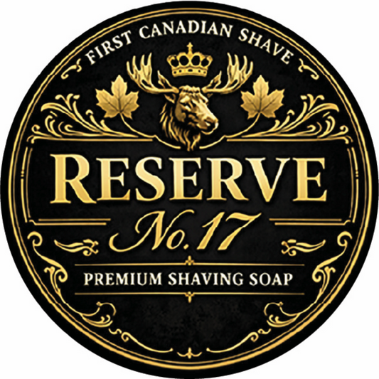 Round label for 'First Canadian Shave Reserve No. 17 Premium Shaving Soap' with gold text and moose design on a black background.