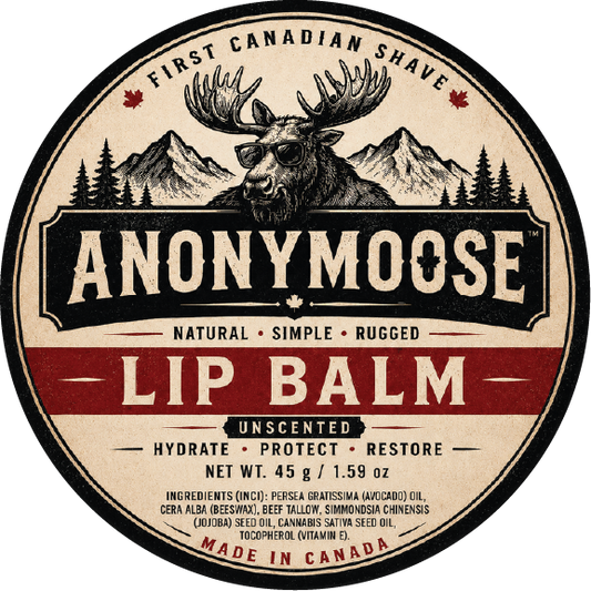 Round product label for Anonymoose Lip Balm, featuring a vintage-style design with a moose head, mountains, trees, and the text 'First Canadian Shave,' 'Natural Simple Rugged,' and 'Lip Balm.'.